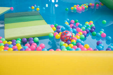 Colored balls in a playground ball pool. Ball with colorful plastic balls in children entertainment centerの写真素材