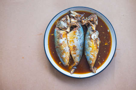 Mackerel boiled in syrup in dish, local food of Thailandの写真素材