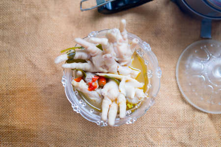 Chicken feet with spicy soup on bowl, Thai style foodの写真素材