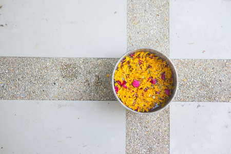 Water and fresh flower in a bowl, Songkran festival in Thailandの写真素材
