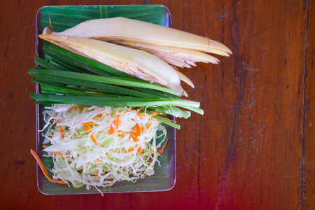 Fresh banana blossom with spring onion and cabbage side dish of Pad thaiの写真素材
