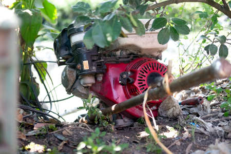 Pumping water into the fields of thai farmerの写真素材
