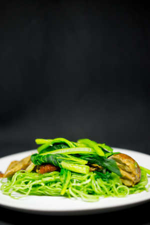 Thai and Chinese style food, green noodle and roasted duck dishの写真素材