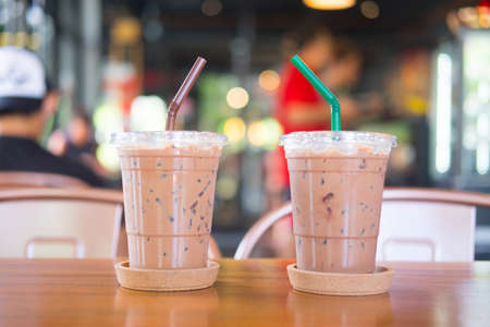 Two iced mocha coffee in plastic cup showing the texture and refreshing look of the drinkの写真素材