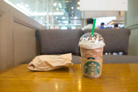 Samut Prakan, Thailand - MAY 6, 2018 - Starbucks cold chocolate drink with whip cream in plastic cup. This is the largest coffee chain storeのeditorial素材
