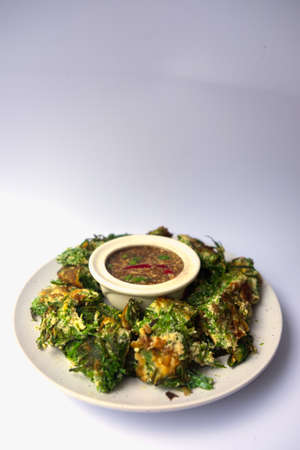 Fried Acacia Pennata Climbing Wattle with egg and shrimp paste chilli sauce (cha-om kai in Thai)の写真素材