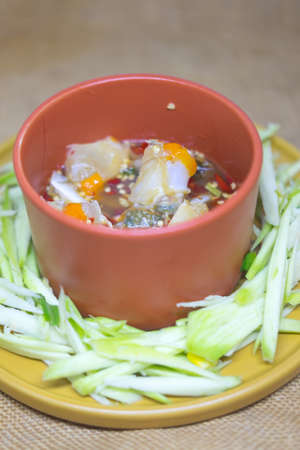 Spicy mango salad with fresh blue crab, hot and spicy appetizer Thai styleの写真素材