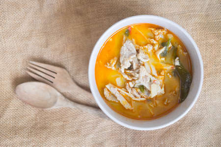 Thai hot and spicy curry with chicken and bamboo shoot in white bowl