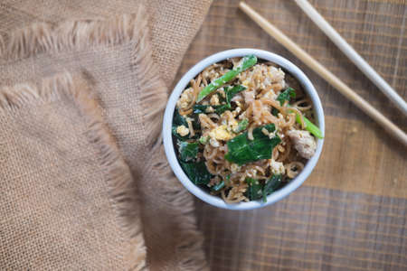 Fried asian instant noodles with minced pork, egg and Chinese kale (Thai style easy homemade...