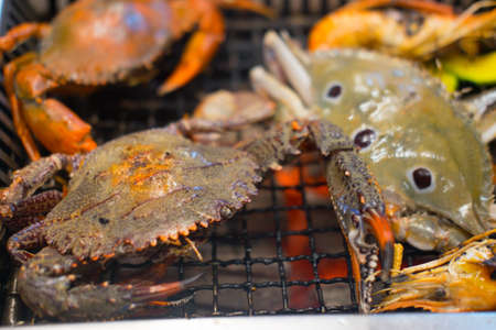 Many grilled crabs on grill. Grill buffet restaurantの写真素材