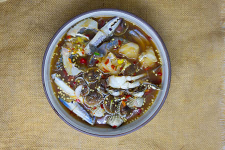 Spicy seafood salad with blue crab and cockle delicious of Thai foodの写真素材