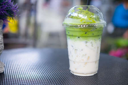 Ice cream green tea float on fresh milk in plastic glass (creativity drink)の写真素材