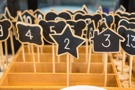 Wooden queue number with various shape  in restaurant