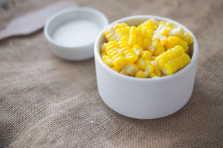 Boiled corn in white bowl ingredient for cookingの写真素材