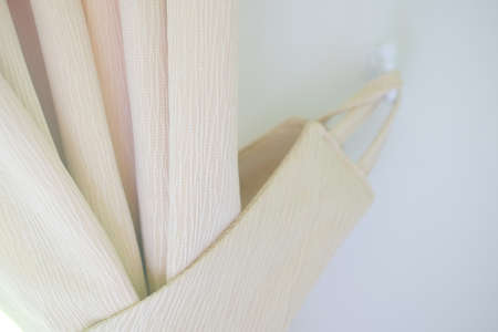 Curtain knob with bow as a decoration in homeの写真素材