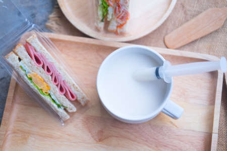 Homemade sandwich and fresh hot milk, breakfast conceptの写真素材
