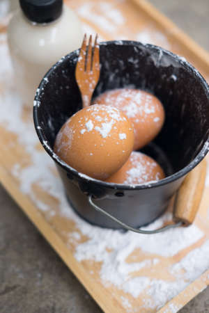 Baking ingredients flour eggs and fresh milk prepare cookingの写真素材