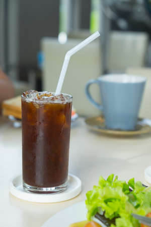 Iced black coffee in a glass in breakfast timeの写真素材