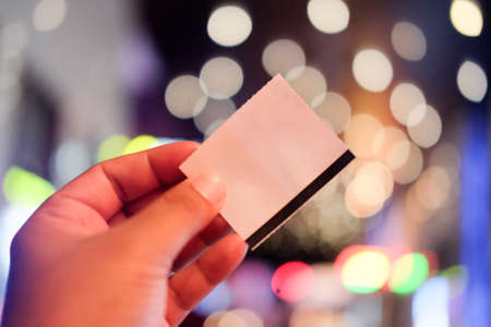 Hand with cinema tickets with blurred backgroundの写真素材