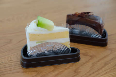 Vanilla cream cake and  chocolate cakeの写真素材