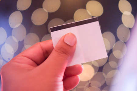 Hand with cinema tickets. Access on entertainment or filmの写真素材