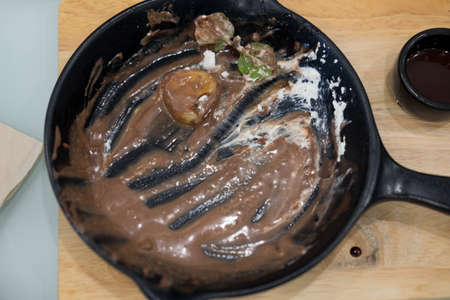 Empty plate after eat cake on wooden desk.の写真素材