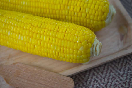 Boiled yellow ripe whole corn. selective focus