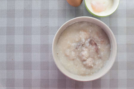 Porridge rice in white ceramic bowl