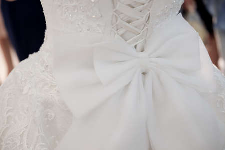 Close-up image of the detailed laces on the back of a wedding dressの写真素材