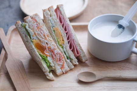 Whole grain sandwich, healthy eating served with fresh milk. Homemade sandwichの写真素材
