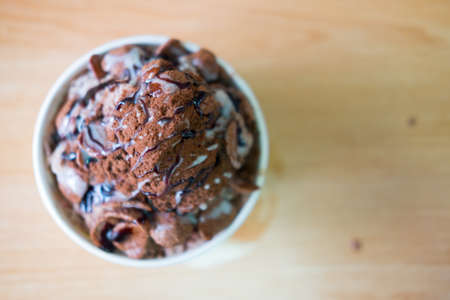 Chocolate ice snowflakes dessert flavor with chocolate powderの写真素材