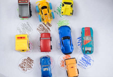 parking of small model cars on paper childhood playthingの写真素材