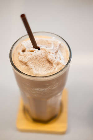Close up glass of chocolate milkshake