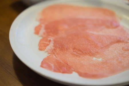 Close up detail of red slices texture of porkの写真素材