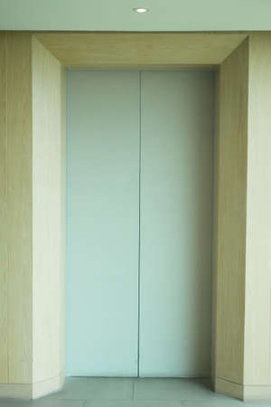 Closed elevator doors inside the apartment buildingの写真素材