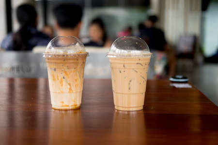 Two iced coffee in plastic cup refreshing look of the drinkの写真素材