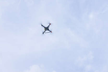 Close-up of a drone against the blue sky at sunny day.の写真素材