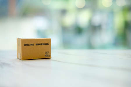 Miniature cardboard box. Online shopping concept e-commerce delivery buying serviceの写真素材