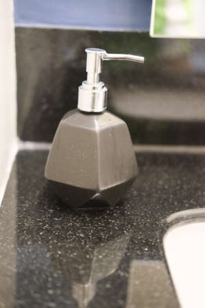 Liquid soap gel bottle with pump in bathroomの写真素材