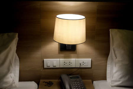 Bed lamp in bedroom in luxury hotelの写真素材