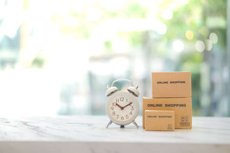 Miniature package box and mini watch with service mind. Fast and easy online shopping concept