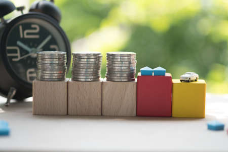 Money, house and a car with clock in the concept of save money  or time investmentの写真素材