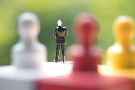 Rear view of miniature businessman. Business competition and Businessman leadership conceptの写真素材