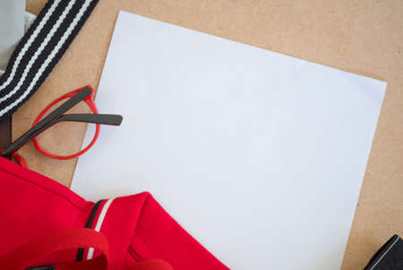 Men clothes and men accessories on wooden background with empty paper for your text