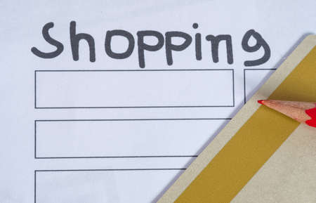 Shopping list paper with red pencil and credit card. Time to shop conceptの写真素材