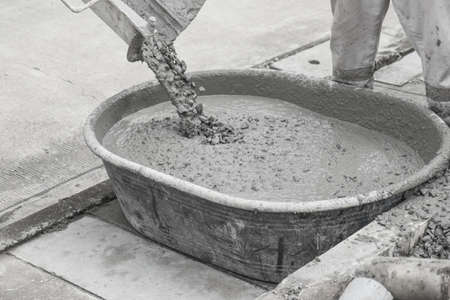 Builders are pouring ready-mixed concrete. Pouring concrete into the construction of the house.の写真素材