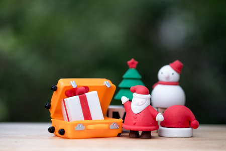 Santa Claus and gift coming to the village to give children a gift, Merry Christmas and Happy New Yearの写真素材