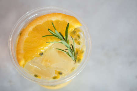 Fresh drink passion fruit tea with in plastic glass. Refreshment beverage conceptの写真素材