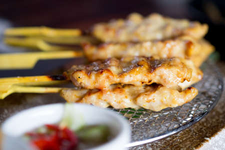 Pork Satay (Thai appetizer). Selective closeup