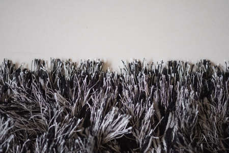 Close up foot mat texture white and black on the floor in the roomの写真素材